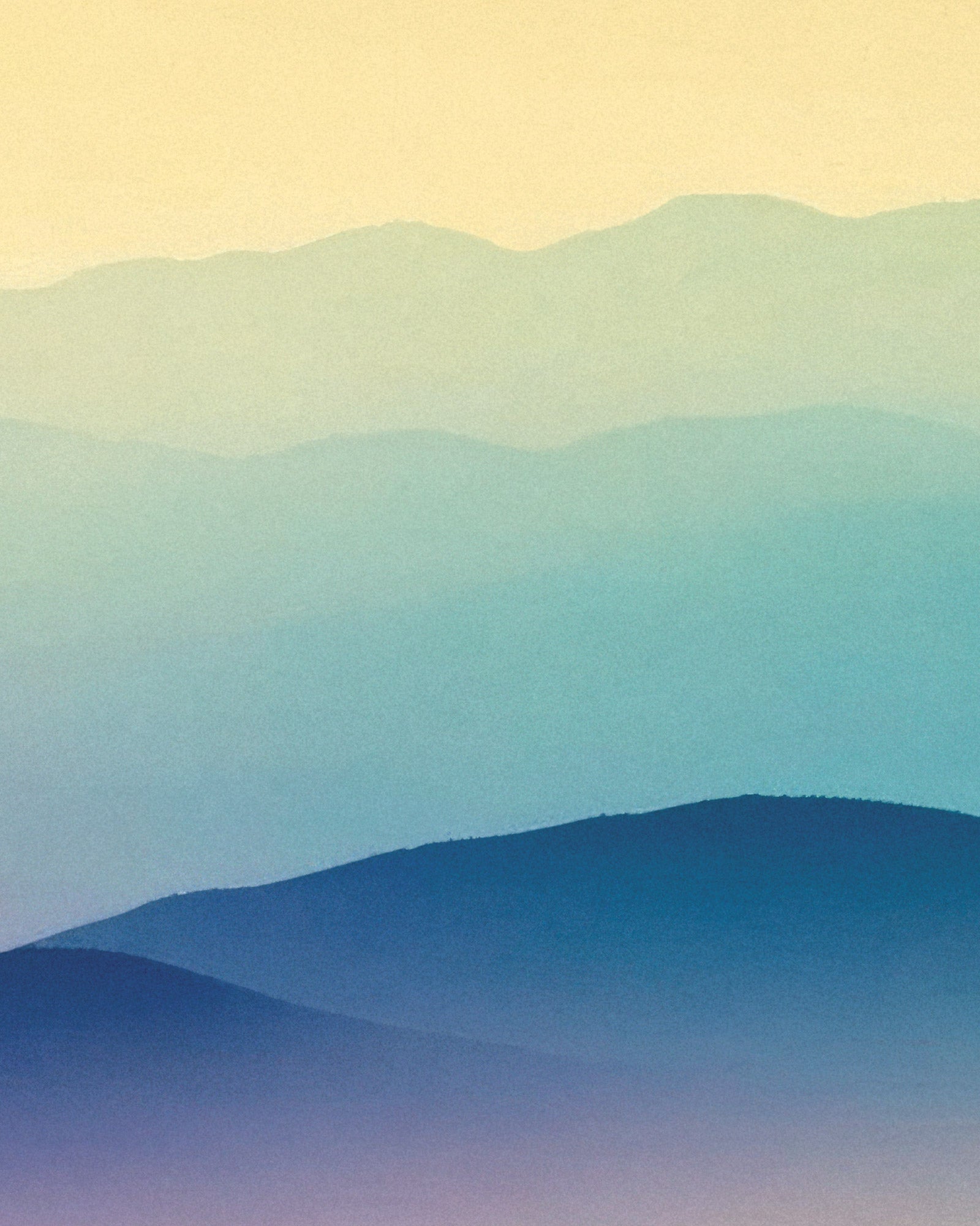 Gradient of blue and green hues on a plain background