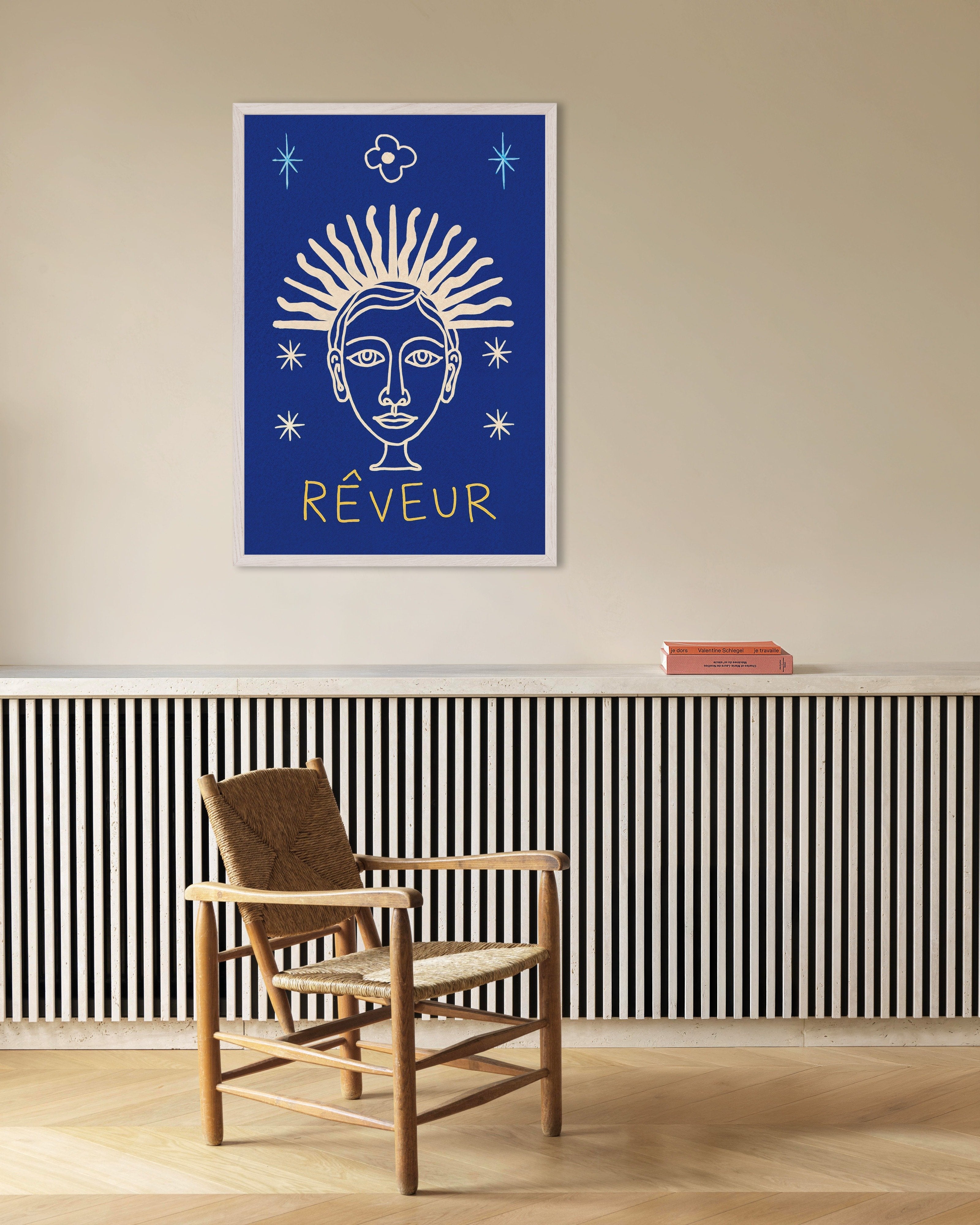 Poster of Rêveur - Sunburst Face on Deep Blue, with white wooden frame